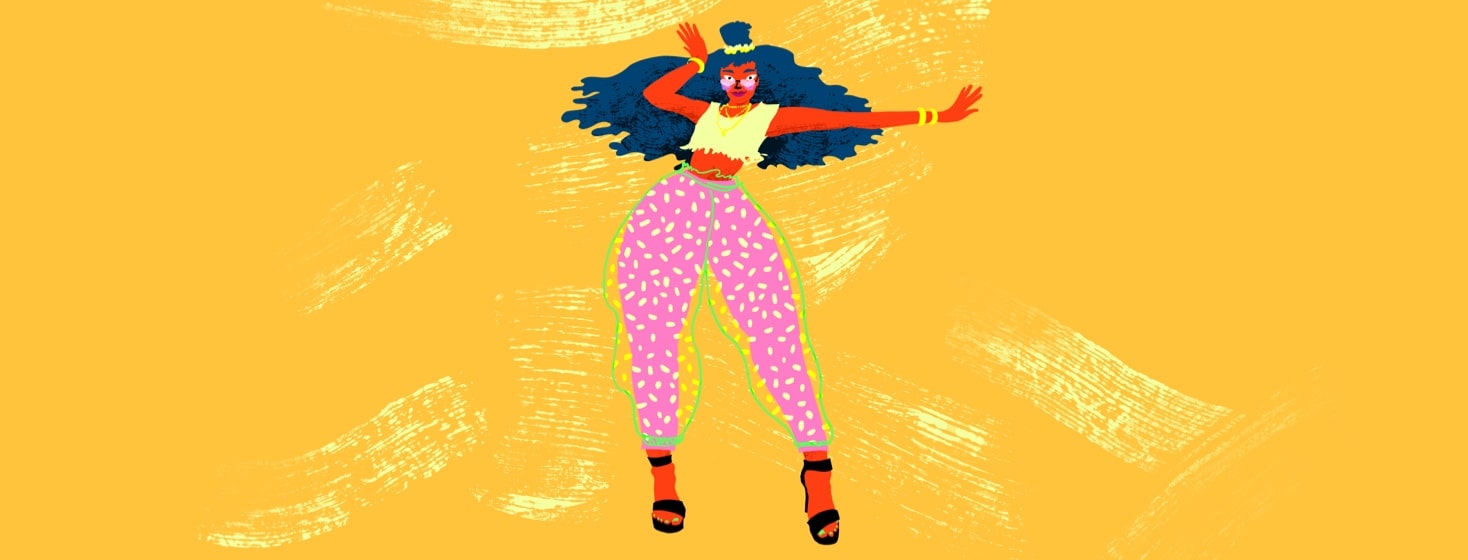 A woman strikes a powerful, sexy pose in a flashy outfit.