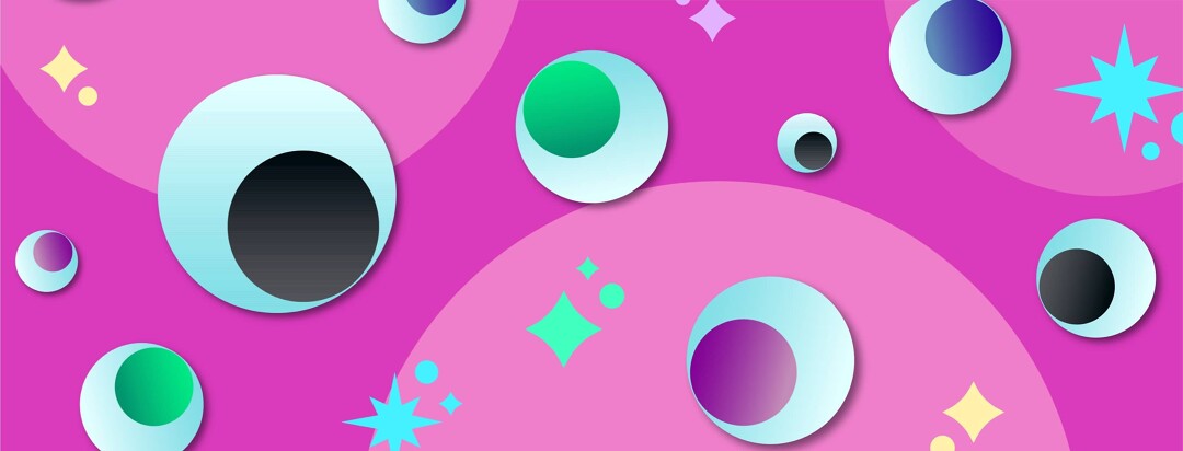 Googly eyes and glitter scattered on pink background