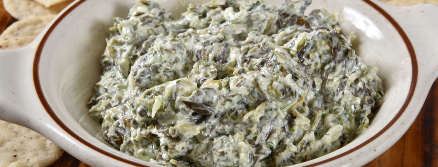 Garlicky Spinach Dip (Non-Dairy) surrounded by crackers