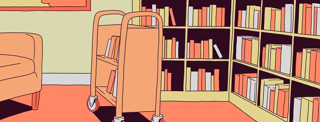 The interior of a brightly colored library with bookshelves, a trolly cart, and a reading chair sitting nestled in front of a scenic window