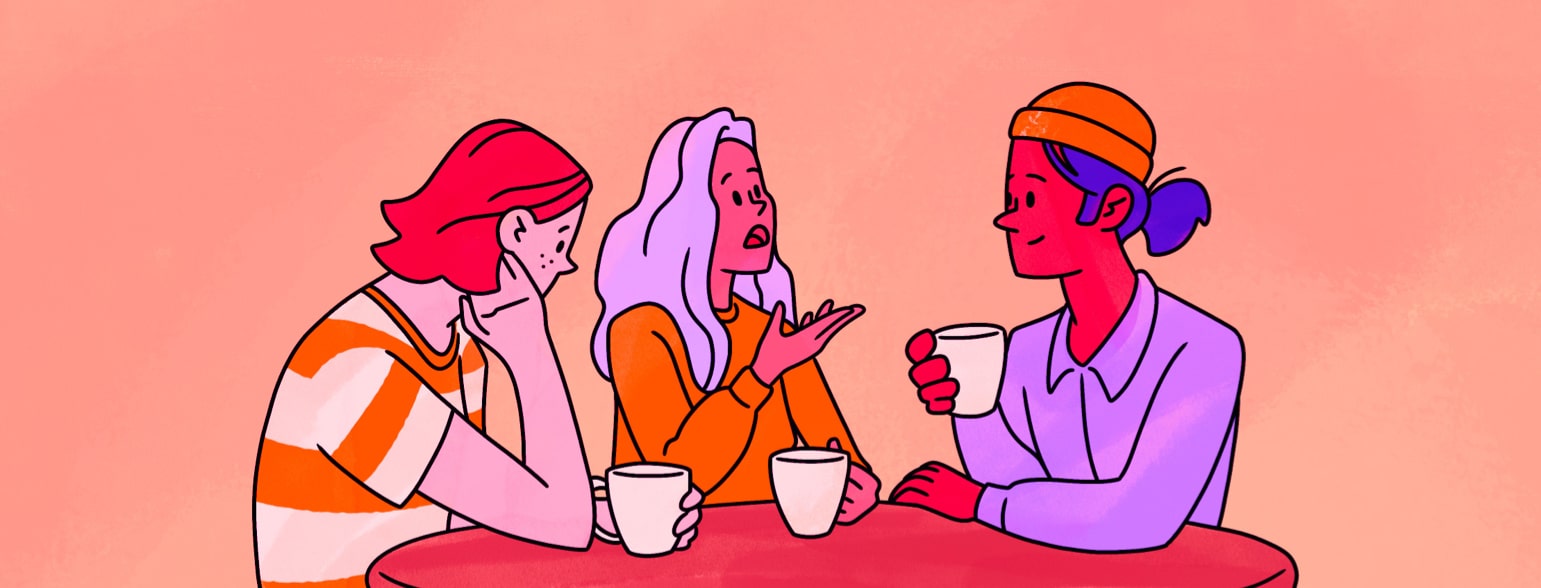 A woman talks with friends over a cup of coffee