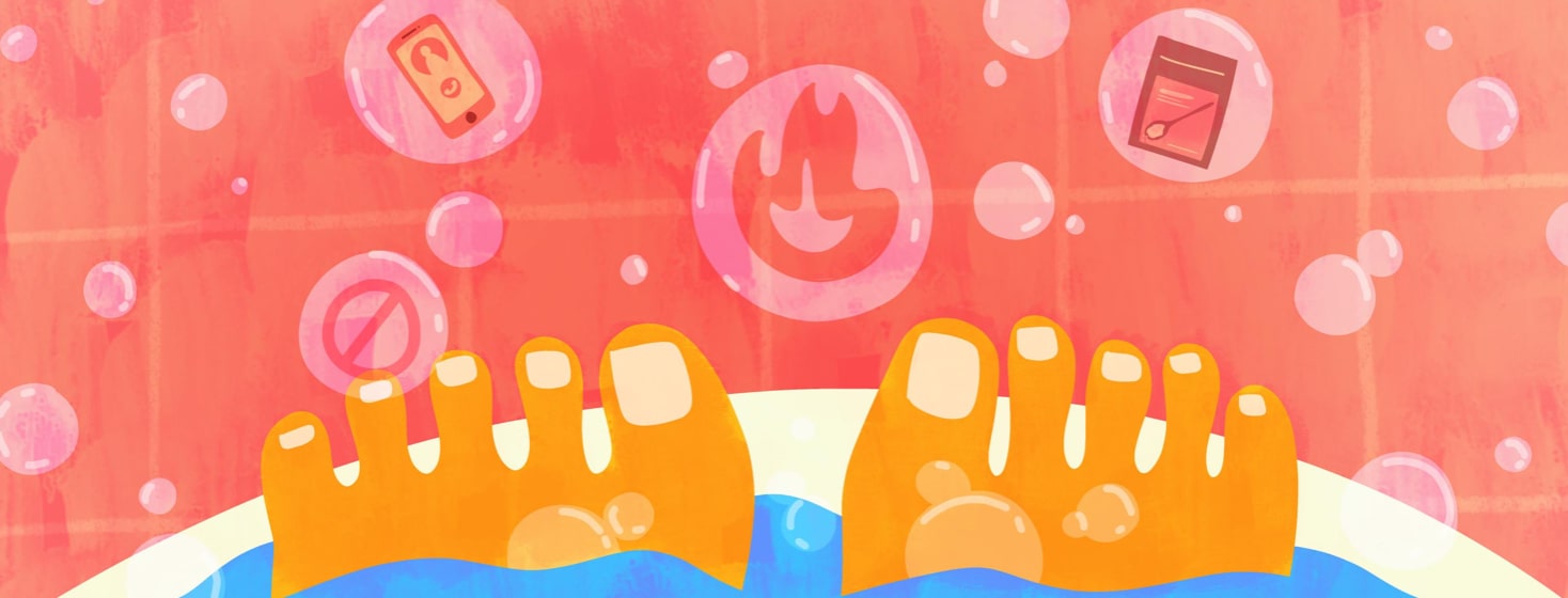 a person in a bath with bubbles floating with a fire, phone, salts, and a no symbol in them